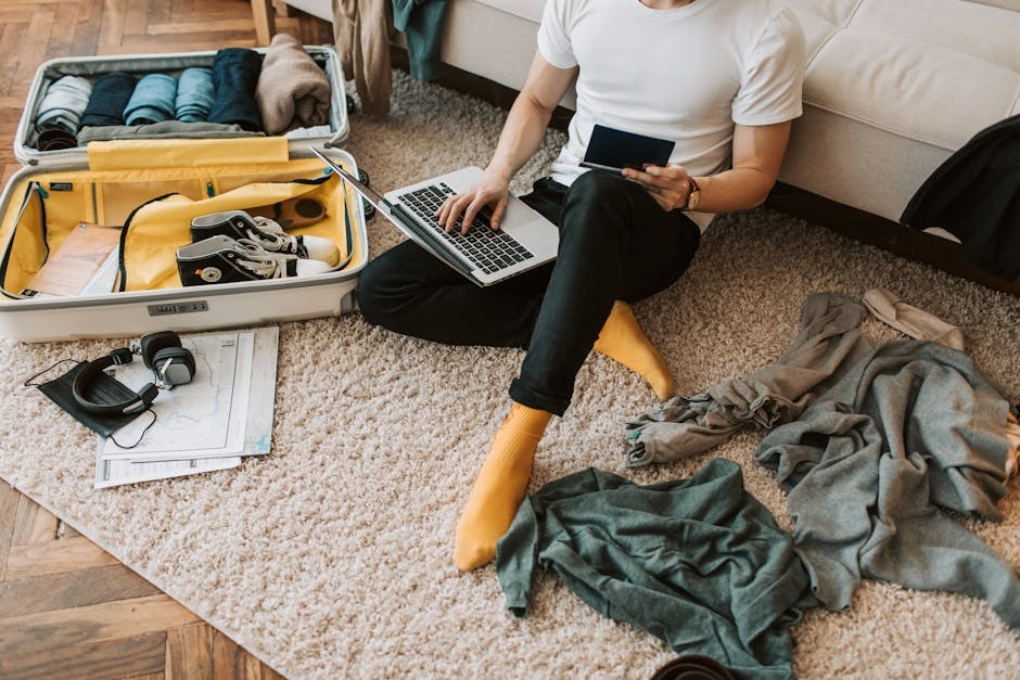 An adult traveler reviewing trip documents at home