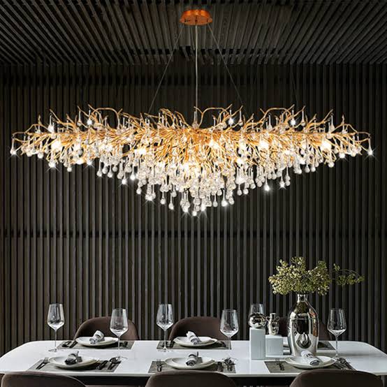 Why an Eight-Light Articulating Chandelier Works Well Over a Dining Table